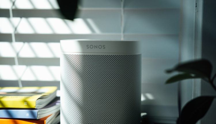 gray and black speaker on white table