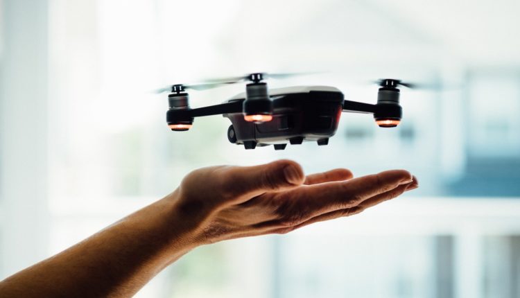 turned on black quadcopter drone