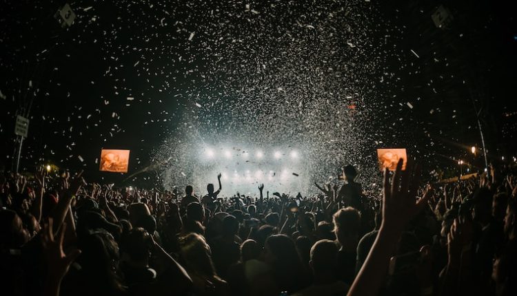 people gathering on concert field