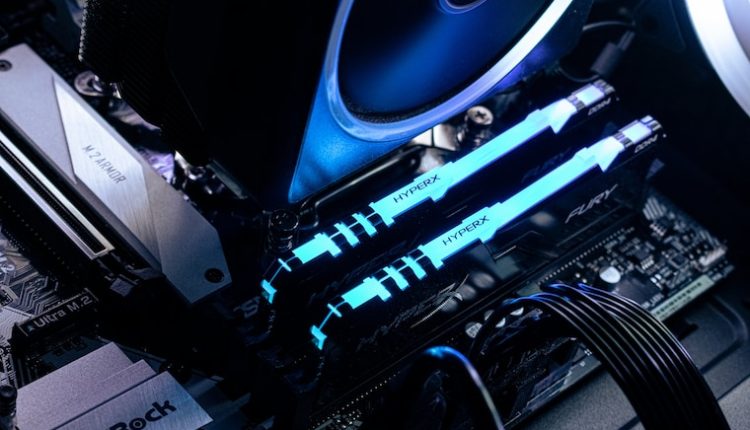 a close up of a computer motherboard with blue lights