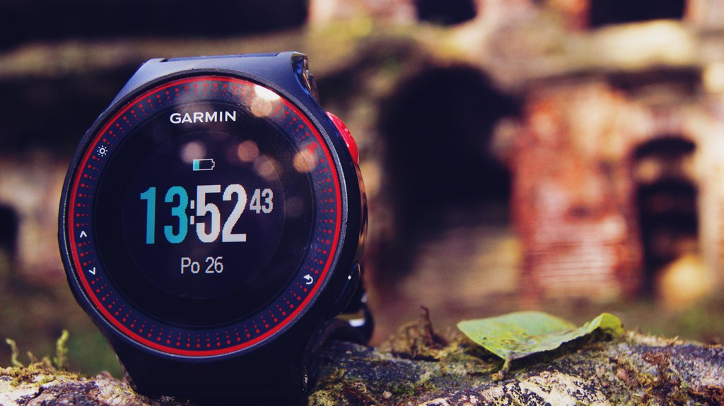 training, smart watch, Garmin Forerunner 📸📸 Realistic photo of a person training outdoors, checking their Garmin Forerunner watch for performance metrics. Background shows a sunset over a field. 📸📸 Людина з Garmin Forerunner під час тренування