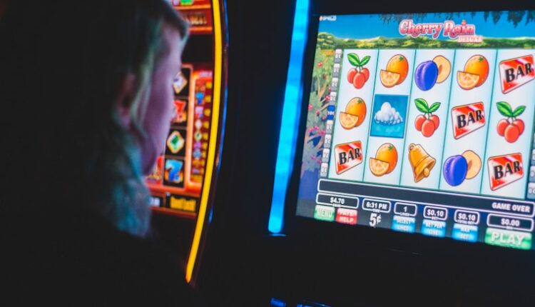 man playing slot machine game